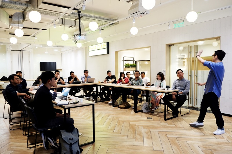Speaker talking in front of audience in a seminar event