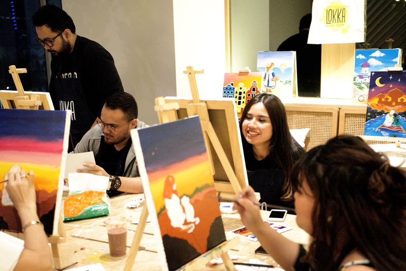 Audience participating in a painting event