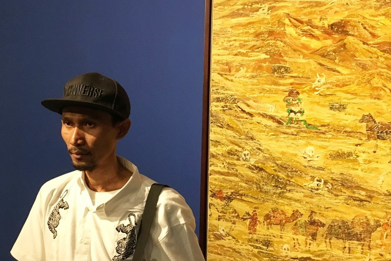Visitor of "Napak Tilas Peradaban" Exploring the Exhibits
