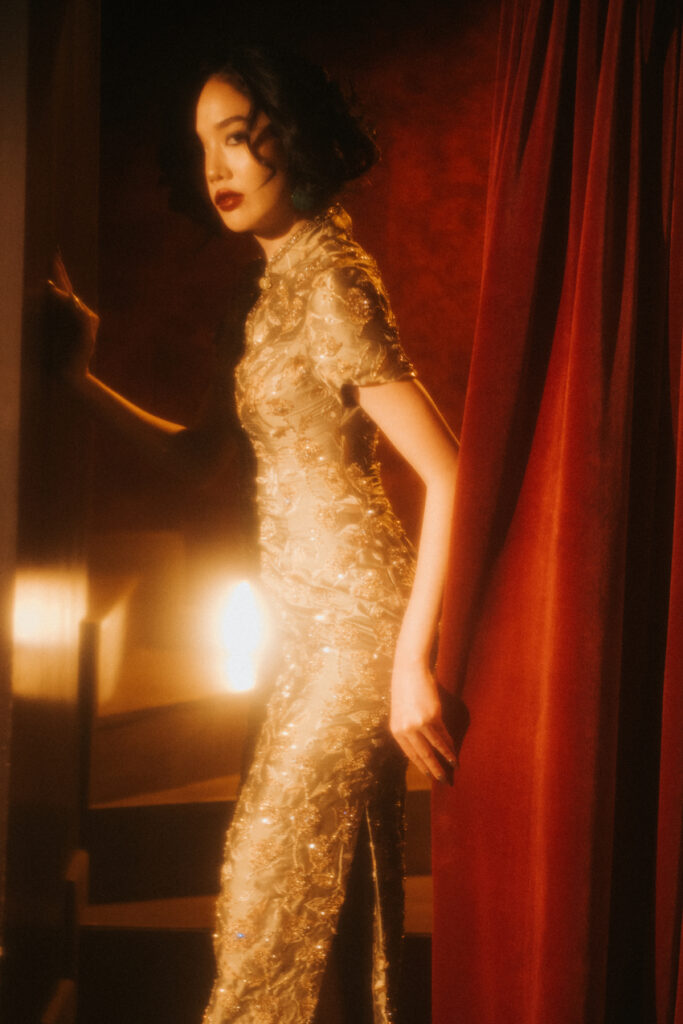 The runway unveiled Shanghai ’62, a mesmerising bridal collection inspired by the moody sophistication and quietly intense desire of 1960s Shanghai and In the Mood for Love. Each creation reflected the magnetic charm of East meets West, where traditional silhouettes were reimagined through modern tailoring, and the delicate tension between restraint and rebellion, where soft femininity was contrasted with bold architectural lines. From intricately embroidered and beaded gowns to velvet tops paired with appliqued French lace skirts, every stich and piece speaks of craftsmanship and artistry.